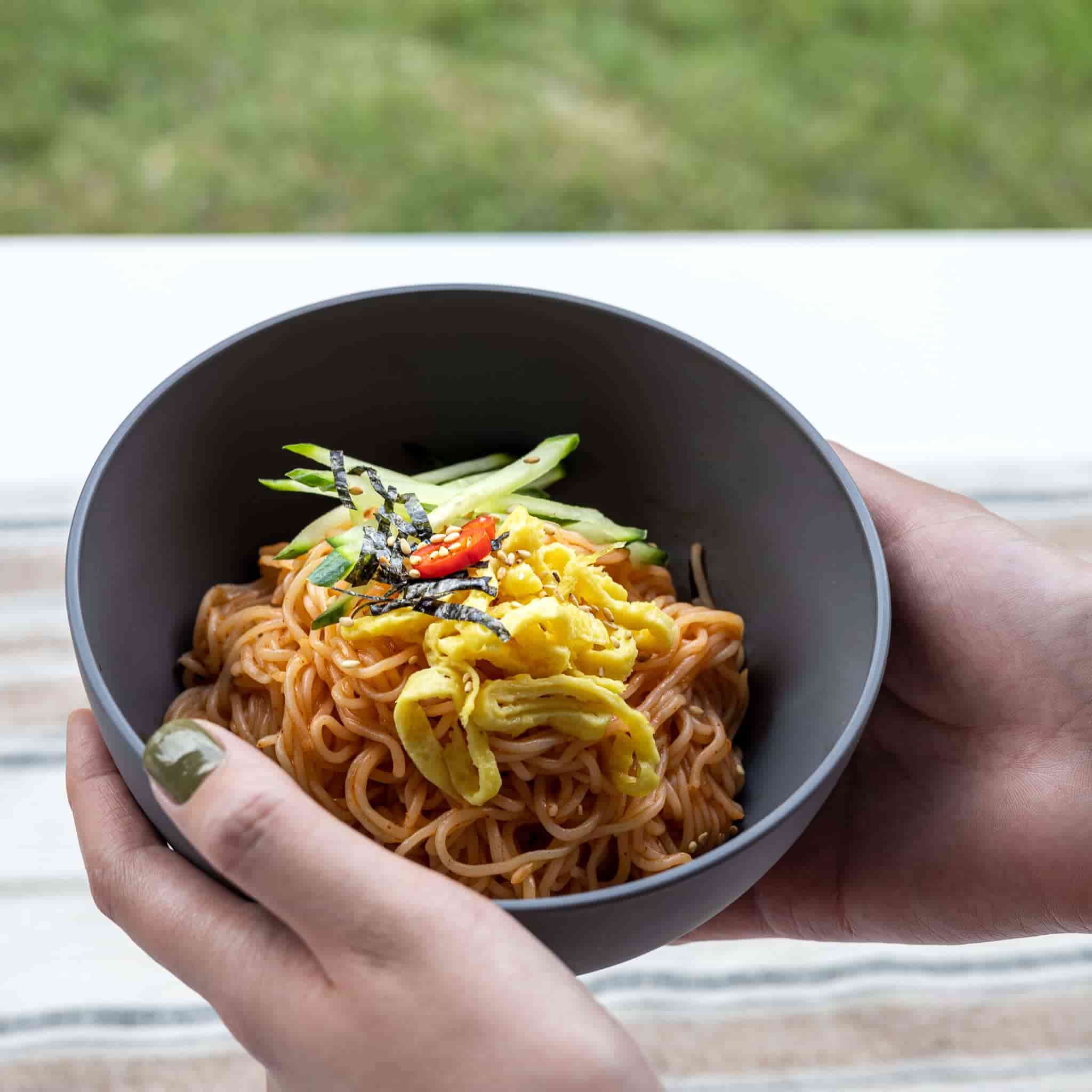 Serving spicy cold noodle in a gray bowl