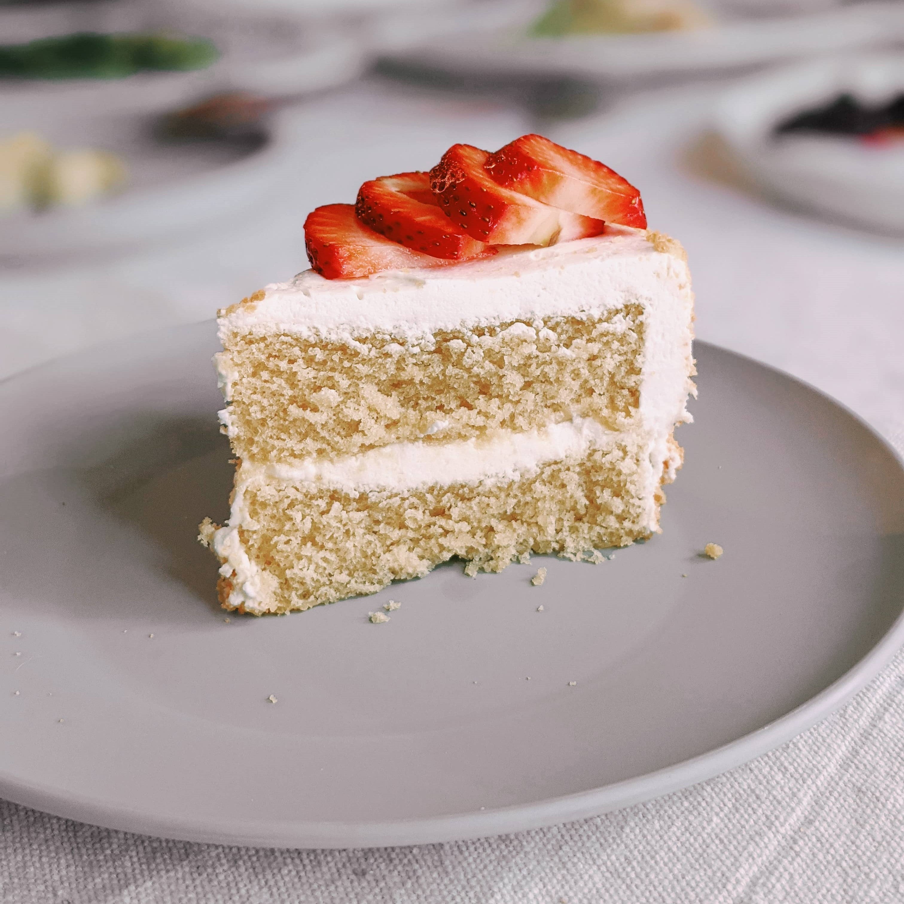 Piece of cake on gray plate